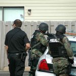 He Targeted The Texas Capitol — His Reason Is NOT What You Think police officers in tactical gear beside patrol car